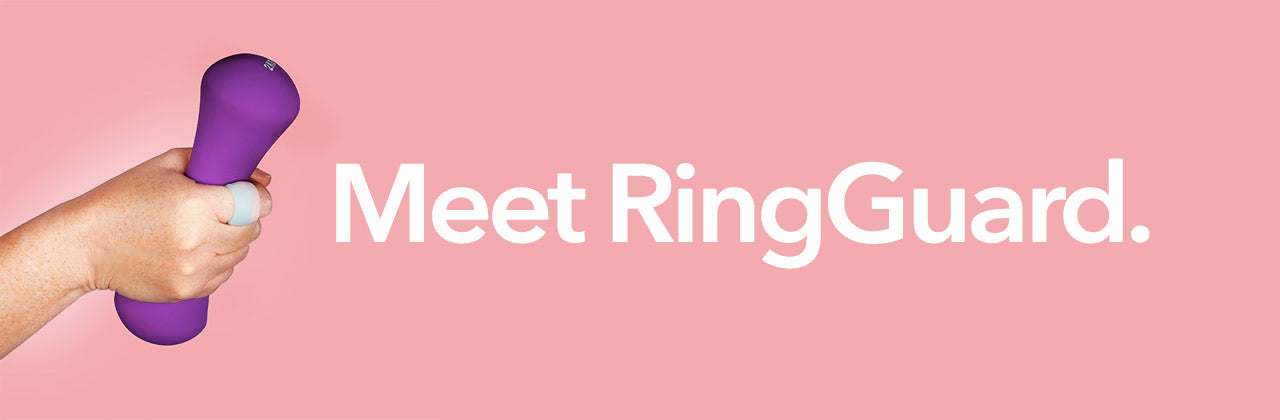 A hand wearing a RingGuard ring guard ring protector lifting weights during workout against pink background, with text reading "Meet RingGuard." 